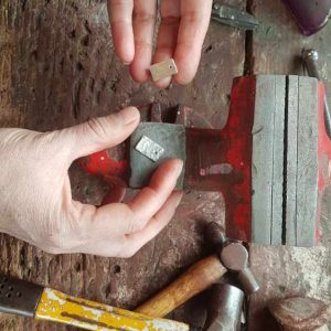 Dunedin Jeweller Alice Carpenter shows the before and after of texturising a jewellery piece with a hammer